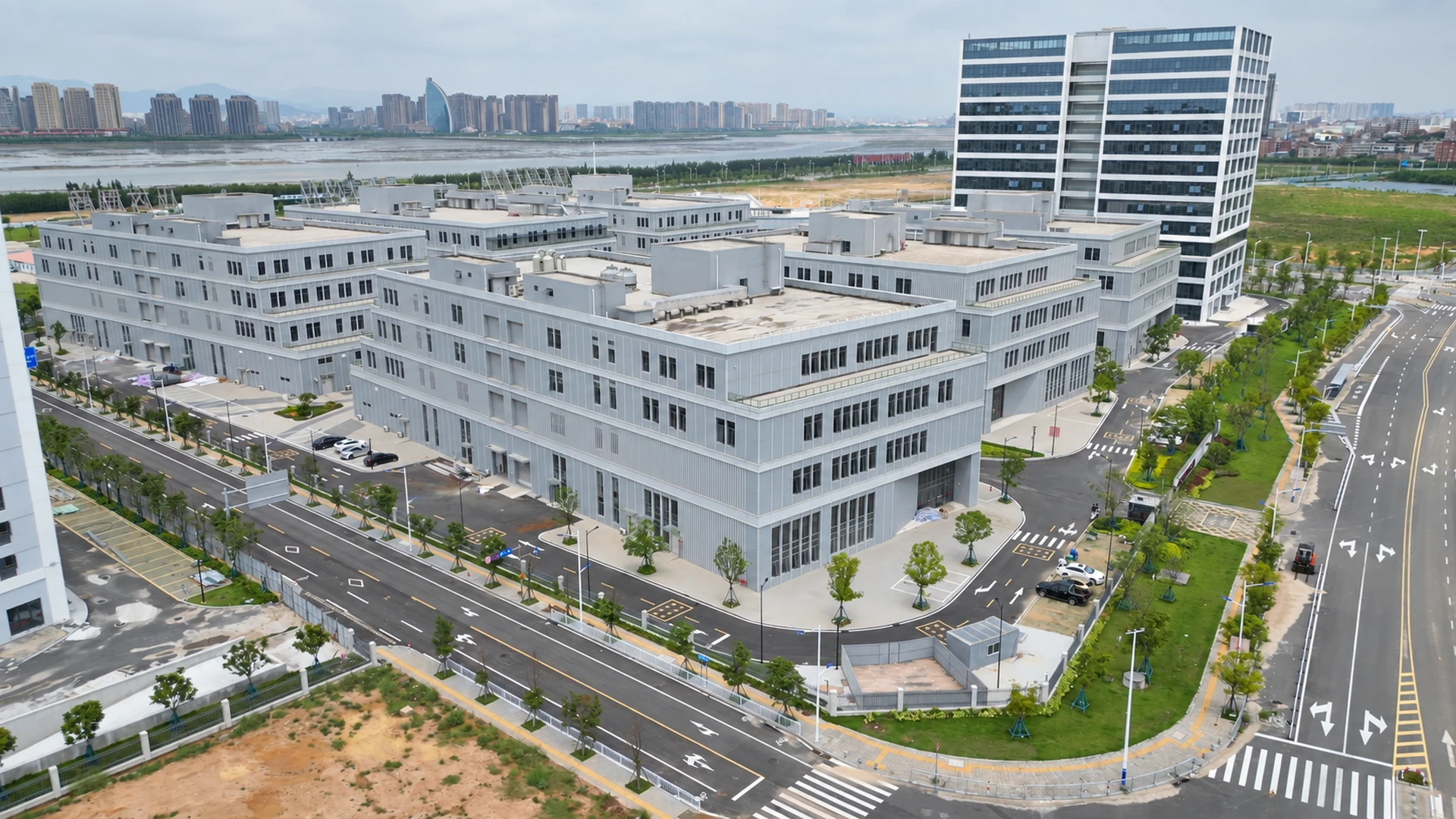 Aerial view of the factory campus buildings and internal roads