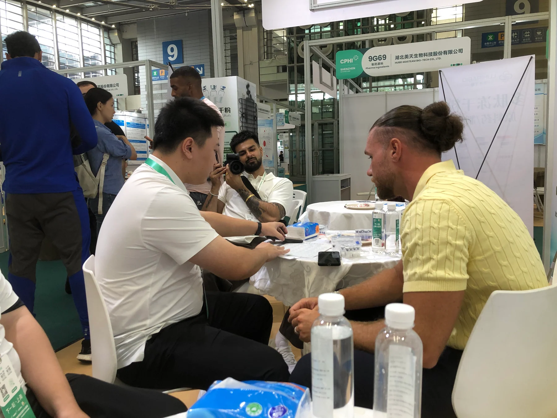 On-site conversation in the Booth 9G75 meeting area