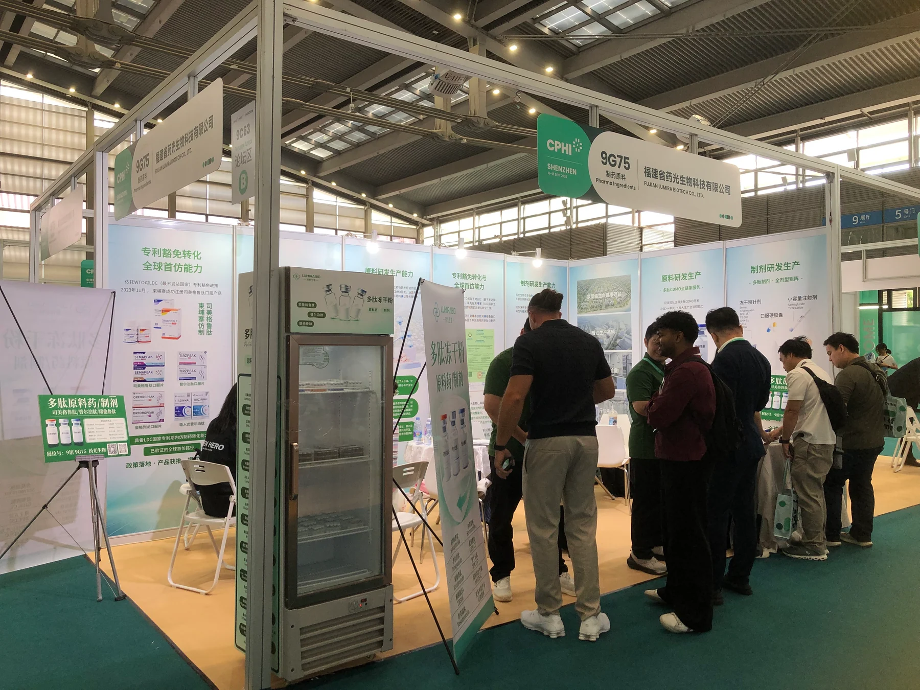 Visitors speaking with the LUMIRABIO team at Booth 9G75 during CPHI Shenzhen